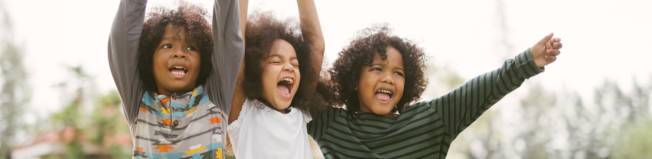 Three kids cheering