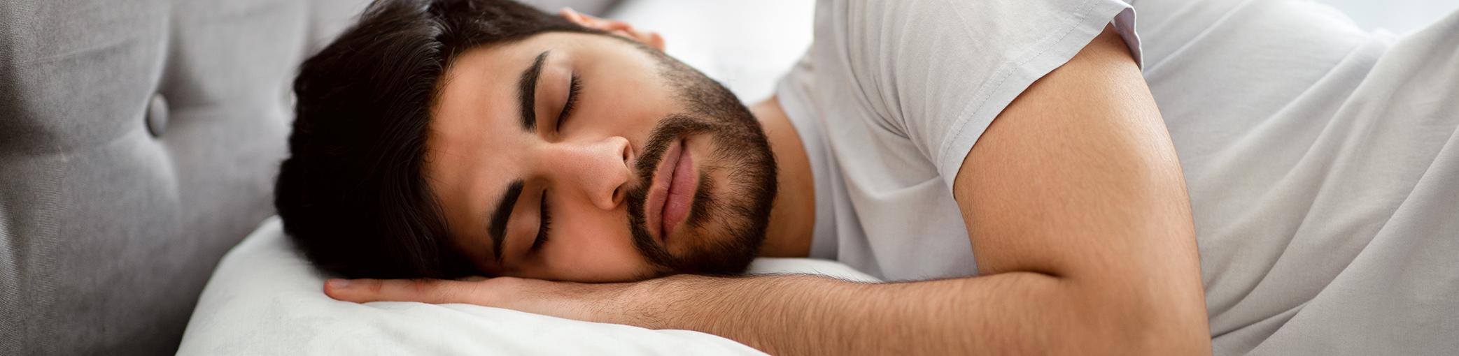 Man sleeping soundly after laser snoring treatment in Bullard