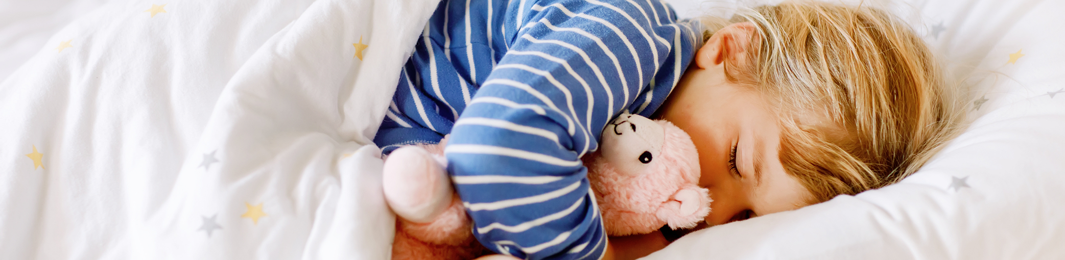 Child sleeping soundly after treatment for kids' sleep apnea in Bullard