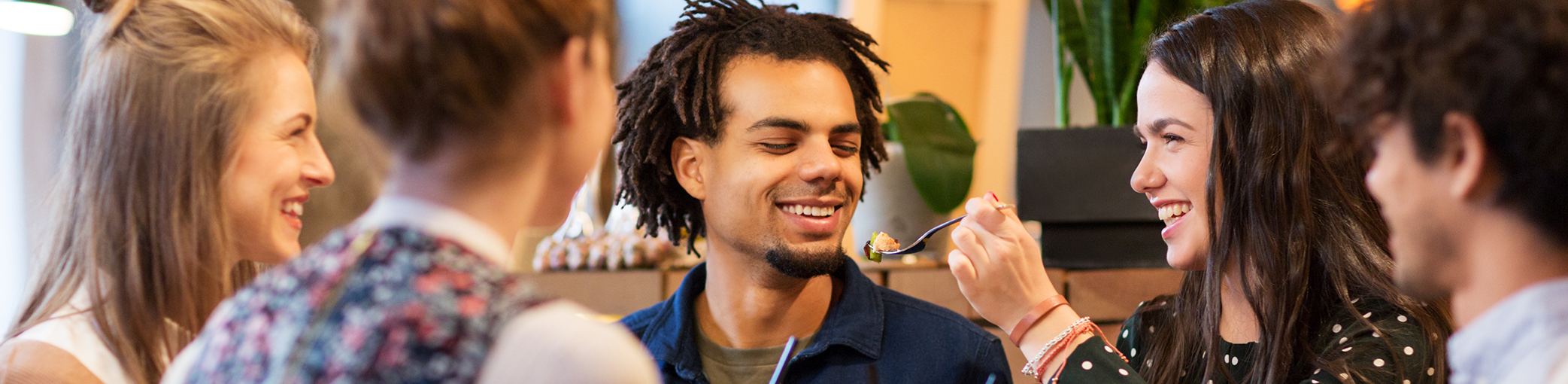 Three adults eating at a restaurant after a dental checkup in Bullard