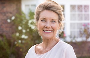 Smiling older woman outdoors