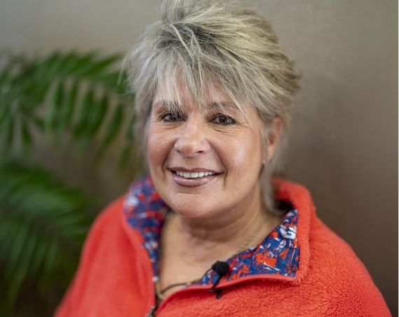 Older woman in a red jacket