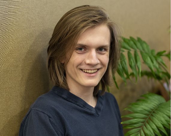 Young man in a navy blue T shirt