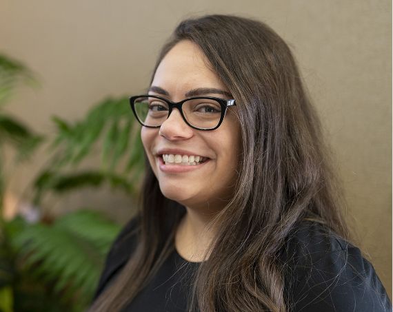 Smiling woman with long dark hair