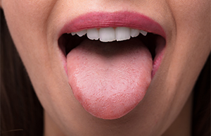 woman performing tongue exercise